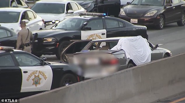 After the fatal shooting, a white sheet was thrown over the car