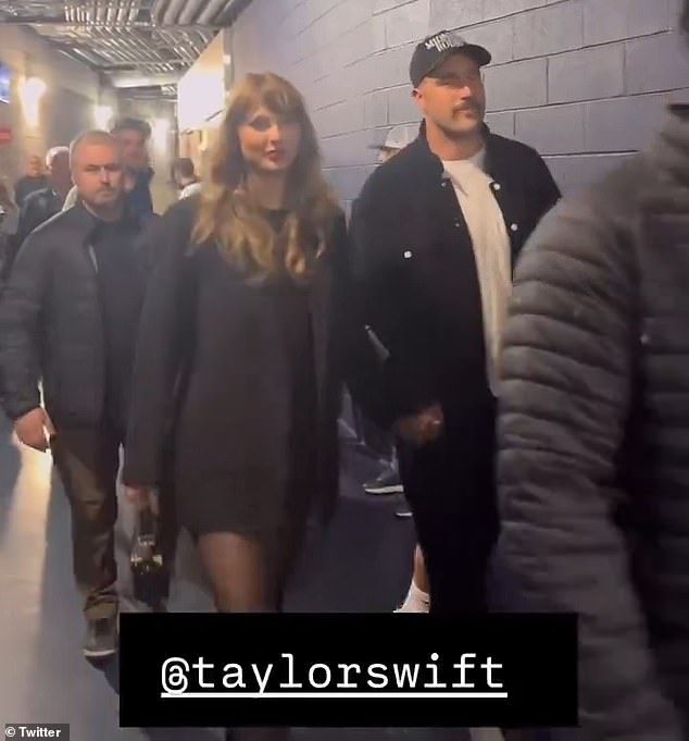 As they left the game, the two held hands while wearing matching black