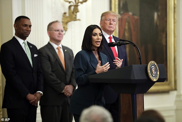 President Donald Trump listens to Kim Kardashian West advocate for criminal justice reform in the East Room of the White House on June 13, 2019