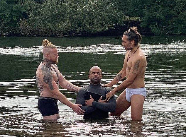 Russell Brand recently converted to Christianity and has been trying to sell himself as a religious influencer. Bran (right) was pictured performing a baptism in his underpants last month