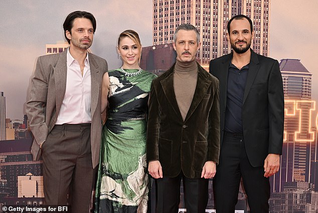 The actress also posed alongside her co-stars Sebastian Stan, (left) Jeremy Strong (centre) and director Ali Abassi (right), who all looked dapper in sharp brown suits.