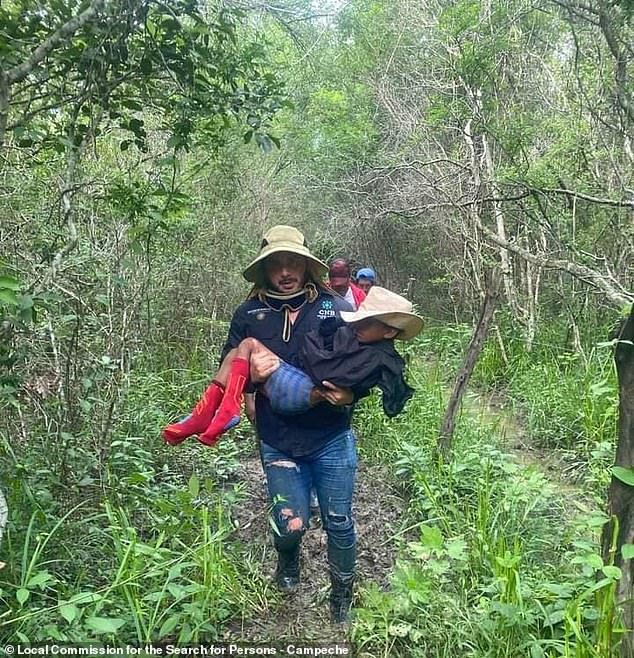 Acosta is carried by one of the workers assigned to the Local Commission for the Search for Persons of the State of Campeche after he was found in the jungle