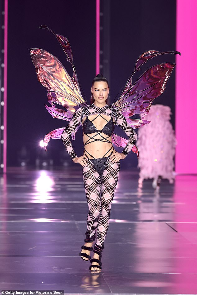 The runway sensation rocked a pair of metallic angel wings and let her brunette locks fall into a high ponytail