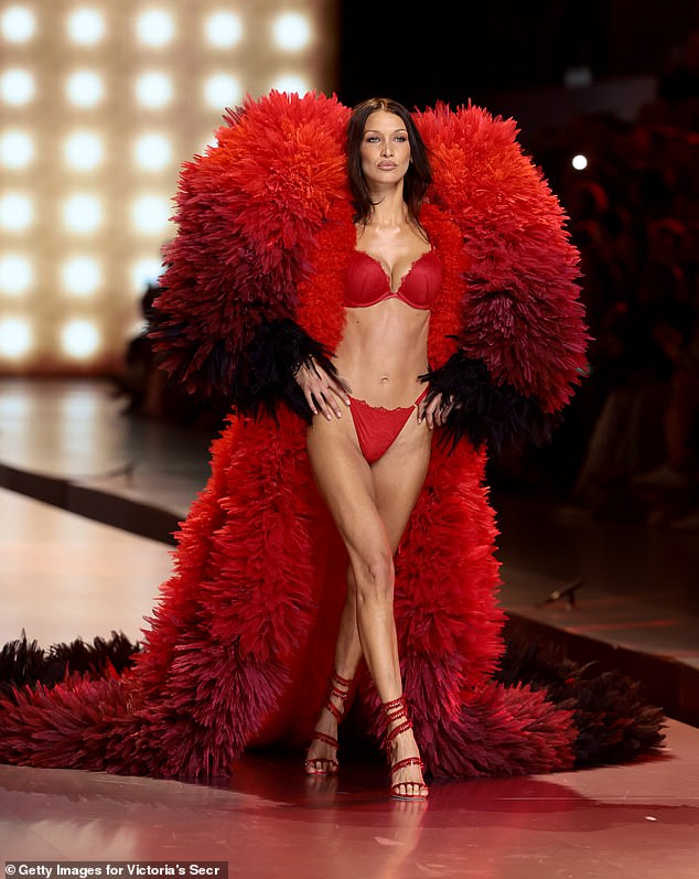 The 28-year-old bombshell showed off her fit figure in a red bra and underwear, topped off with a huge red fur coat