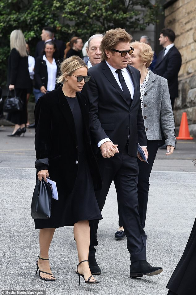 The veteran entertainment reporter held hands with the celebrity make-up artist as they entered St Francis Xavier Church in Lavender Bay to say their final goodbyes to Janelle Kidman.