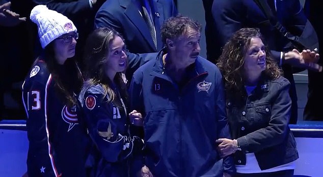 Johnny and Matthew's parents and sister watched the tribute from the sidelines