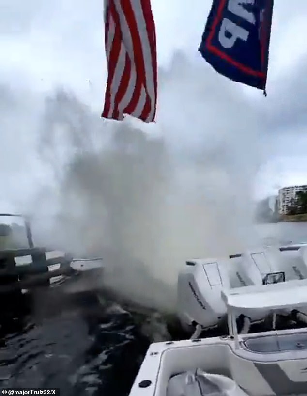 Angry Republicans ahead of the neo-Nazis splash their boat with a wave of water during the parade, seen in a now-viral video