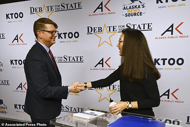 Republican candidate for the House of Representatives Nick Begich and incumbent Democratic Rep. Mary Peltola shaking hands after a debate