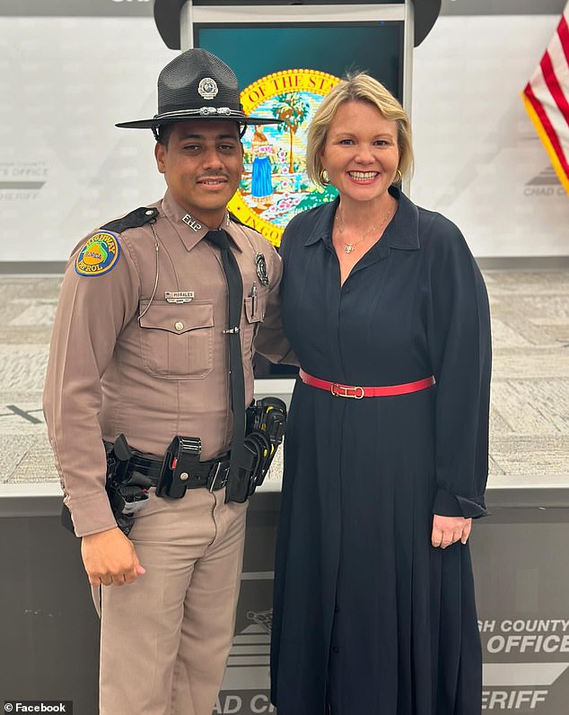 Florida Highway Patrol Trooper Orlando Morales (left) received a tip about the animal and found it in the lawn