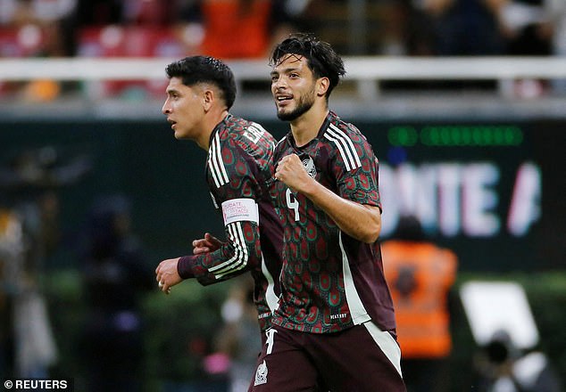 Fulham striker Raul Jimenez (right) opened the scoring for Mexico in the first half