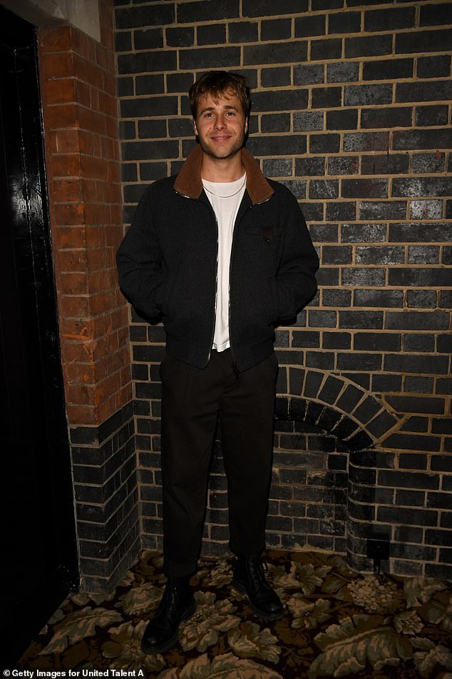 The Crown star Ed McVey opted for a black jacket with a sheepskin collar, which he teamed with matching trousers and a white T-shirt