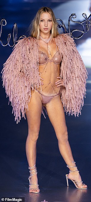 The model put on a very leggy show in the skimpy pink underwear