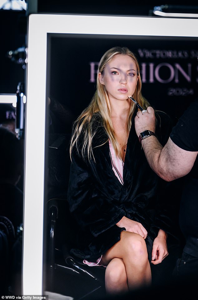 Lila was photographed getting ready backstage in Brooklyn for the Victoria's Secret Fashion show earlier on Tuesday, surrounded by makeup artists