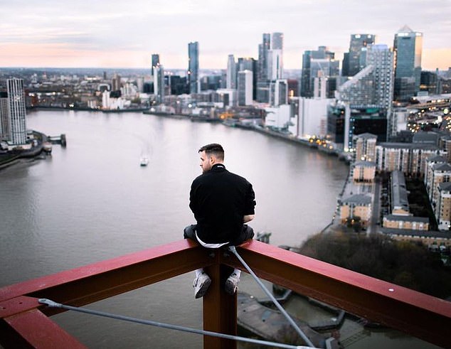 One photo shows Stevenson resting on a metal beam overlooking the City of London