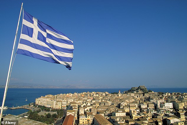 In the photo: a Greek flag flies over the island of Corfu