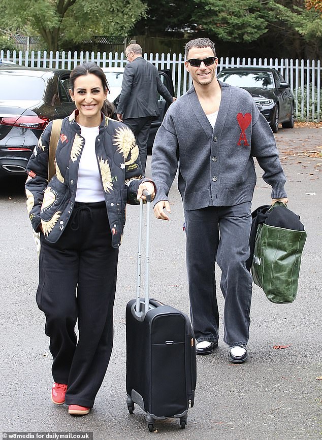 The dancing duo narrowly avoided elimination last week but appeared relaxed in coordinating gray and red outfits