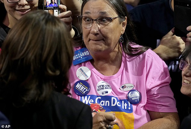 Democratic presidential candidate Vice President Kamala Harris (left) greets a supporter after speaking at a campaign rally at the Erie Insurance Arena, in Erie, Pennsylvania.