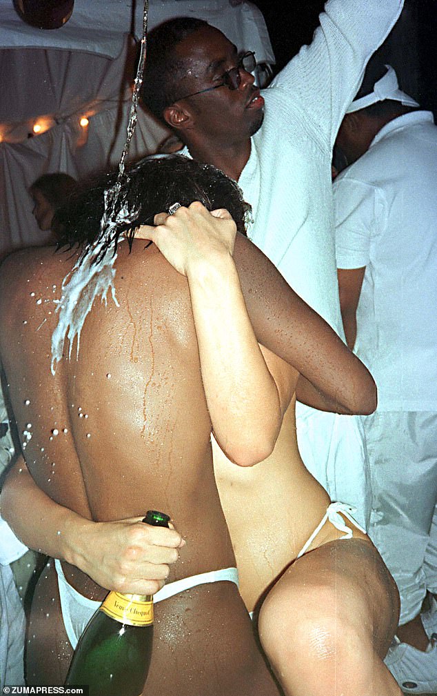 Diddy pours champagne on two nearly naked women during his 1998 Labor Day party