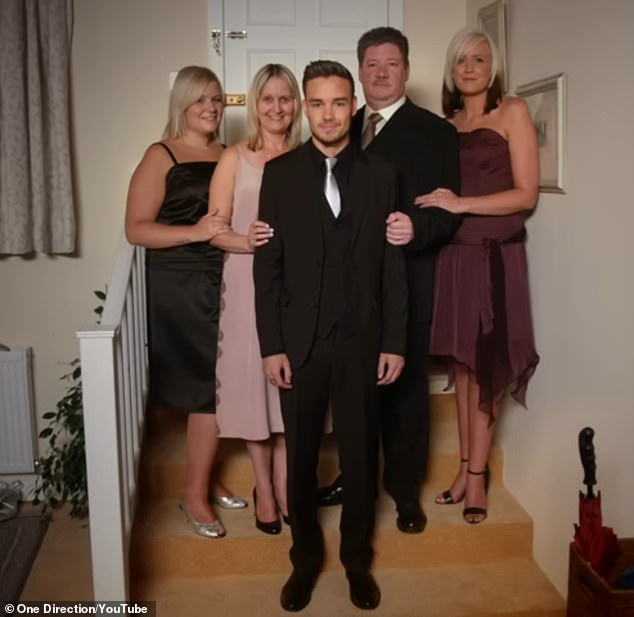 In the video, Liam is dressed up and surrounded by his sisters Nicole and Ruth, as well as his mother and father, Geoff and Karen.