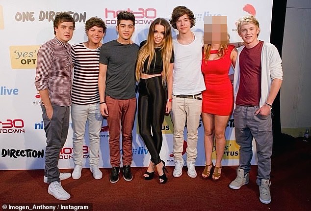 The 34-year-old influencer posted a photo to Instagram of her and a friend posing up a storm with 1D while on tour Down Under in 2012, with Imogen claiming her friend had 'lost her virginity' to a bandmate that night. Pictured: Imogen and her boyfriend with 1D