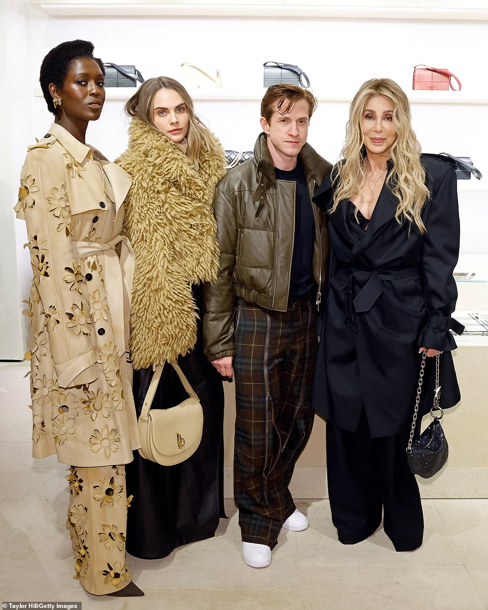 The 78-year-old American pop diva (R) and 32-year-old English model-actress (2-L) lent their star power to the British luxury fashion house event as they posed with English model-actress Jodie Turner. Smith (L) and CCO Daniel Lee (2-R) of Burberry Group