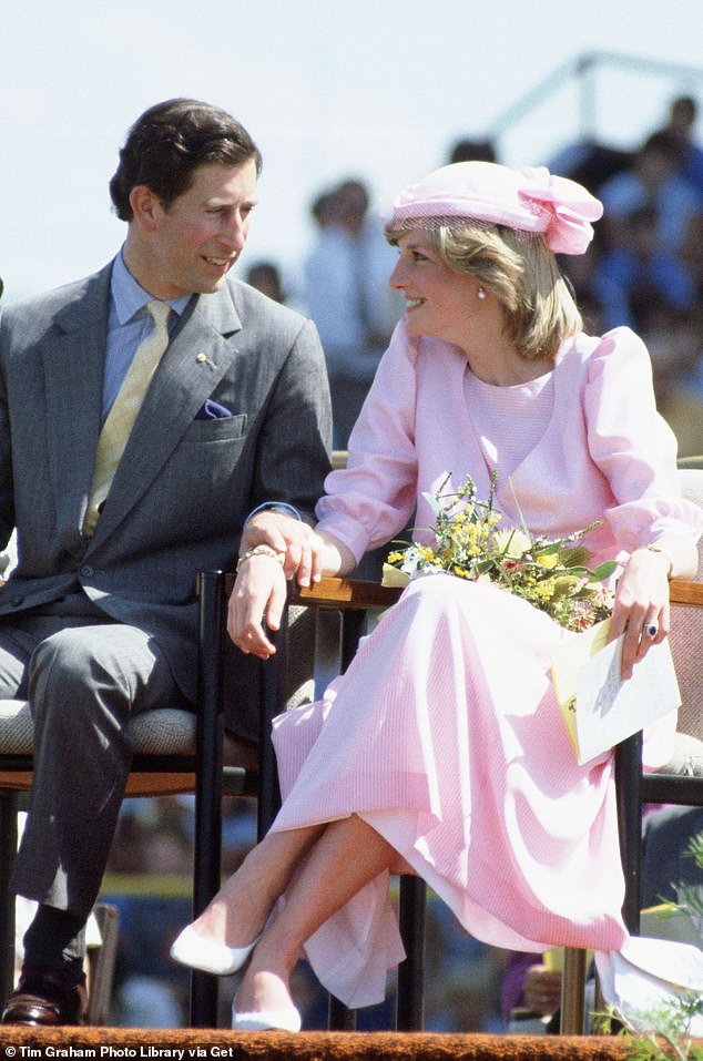 The Prince of Wales lovingly shakes hands with Diana during their first joint tour to Australia