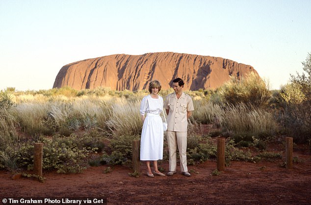 Diana and Charles pose for photos at Ayers Rock (now known as Uluru) in the Northern Territory