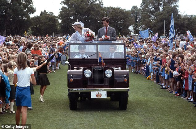 The couple stood in a Land Rover at the Hands Oval sports field in Western Australia as Diana accepted gifts from children