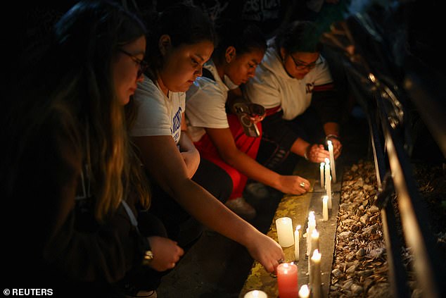 Fans placed candles outside the Casa Sur Hotel in Buenos Aires, Argentina yesterday