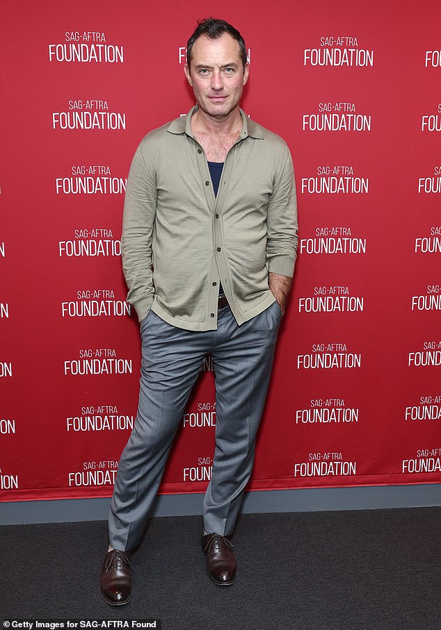 The actor cut a smart figure for the event as he donned a beige vest, gray pants and brown shoes