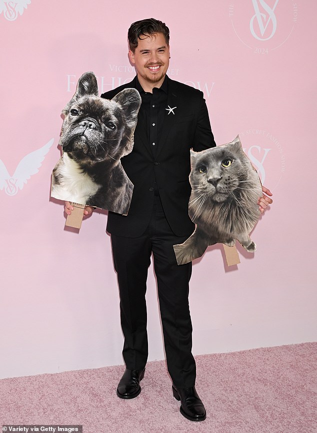 Barbara's husband Dylan Sprouse arrived on the pink carpet with cardboard cutouts of their pets in hand