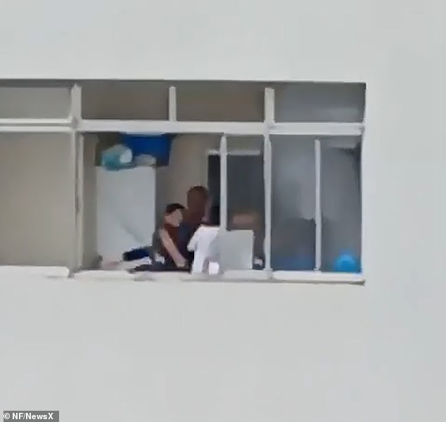 The woman was eventually rescued when people below the building clapped