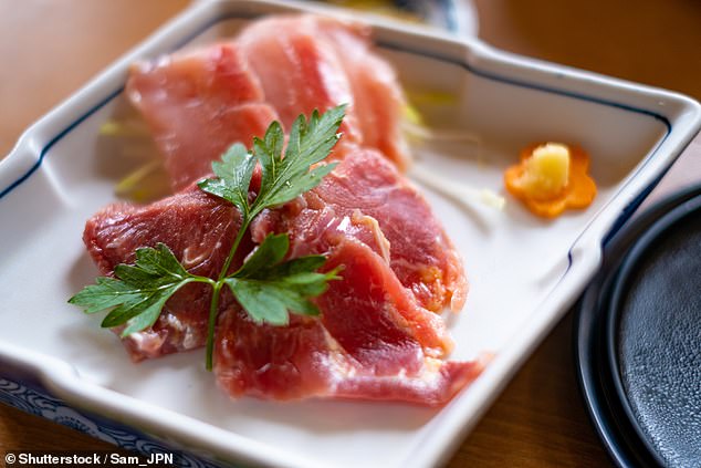 One Redditor visited Japan and ordered what they thought was fish sashimi. It turned out to be raw chicken (above, stock image)