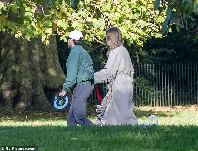 Horan looked glum as he and Amelia took their dog for a walk in the park