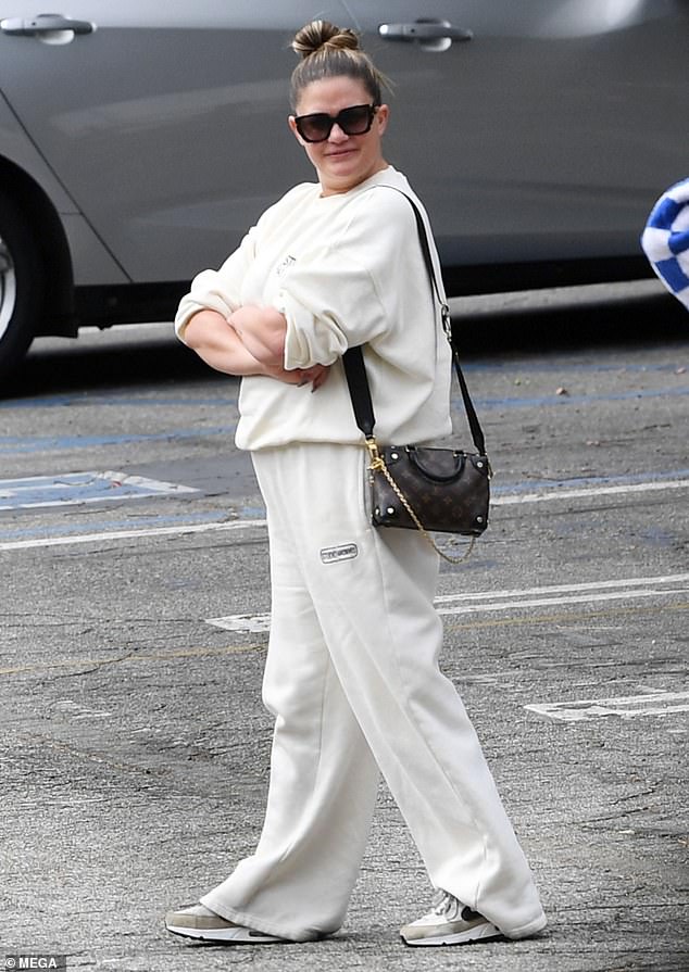 Brittany was comfortably dressed, wearing a loose white tracksuit and matching Nike sneakers