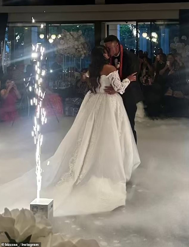 The happy couple share their first dance as husband and wife in their formal attire