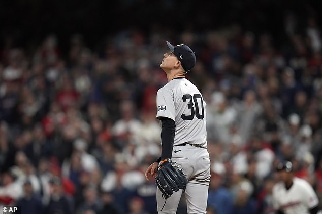 Yankees pitcher Luke Weaver watches as Jhonkensey Noel's home run flies over the wall