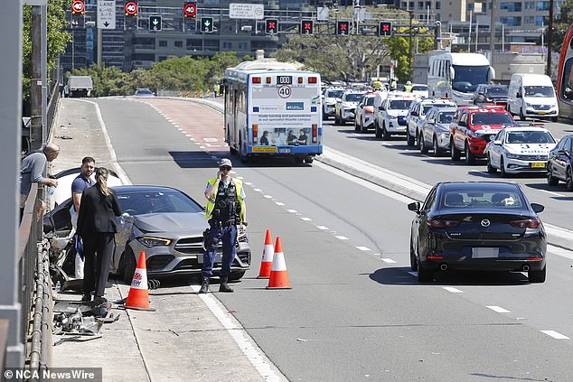 The crash brought traffic to a standstill (pictured) with queues of up to 12km across Sydney