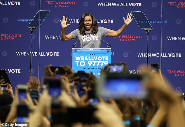 Former first lady Michelle Obama speaks during a When We All Vote's National Week of Action rally at the University of Miami's Watsco Center on September 28, 2018 in Coral Gables, Florida. Obama is the founder and co-chairman of the organization that aims to help people register and vote