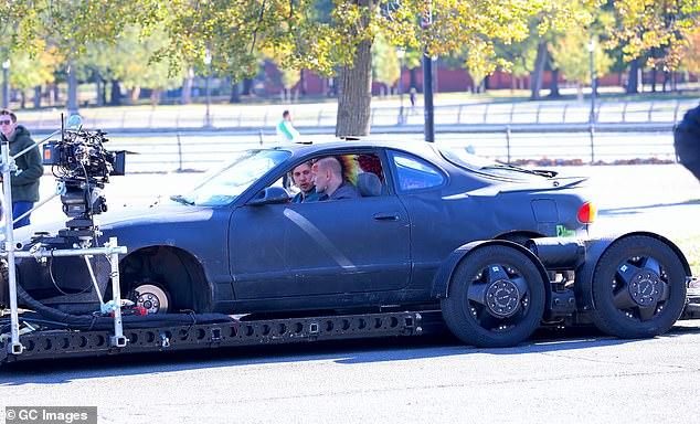 Meanwhile, Austin, who was sitting in the passenger seat of a car, was spotted with greasy blond hair and wearing a relaxed shirt