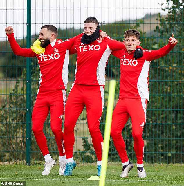 Graeme Shinnie, Kevin Nisbet and Leighton Clarkson show the spirits in the Dons camp