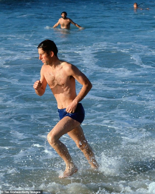 Prince Charles runs in the surf at Bondi while taking time off during his official Australian tour in 1981, three months before his wedding to Princess Diana