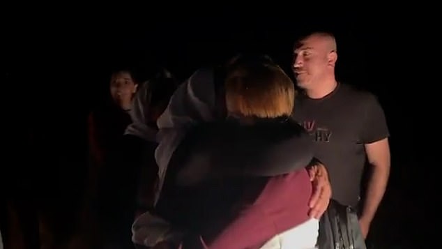 The young woman hugs loved ones after reportedly spending 10 years in captivity