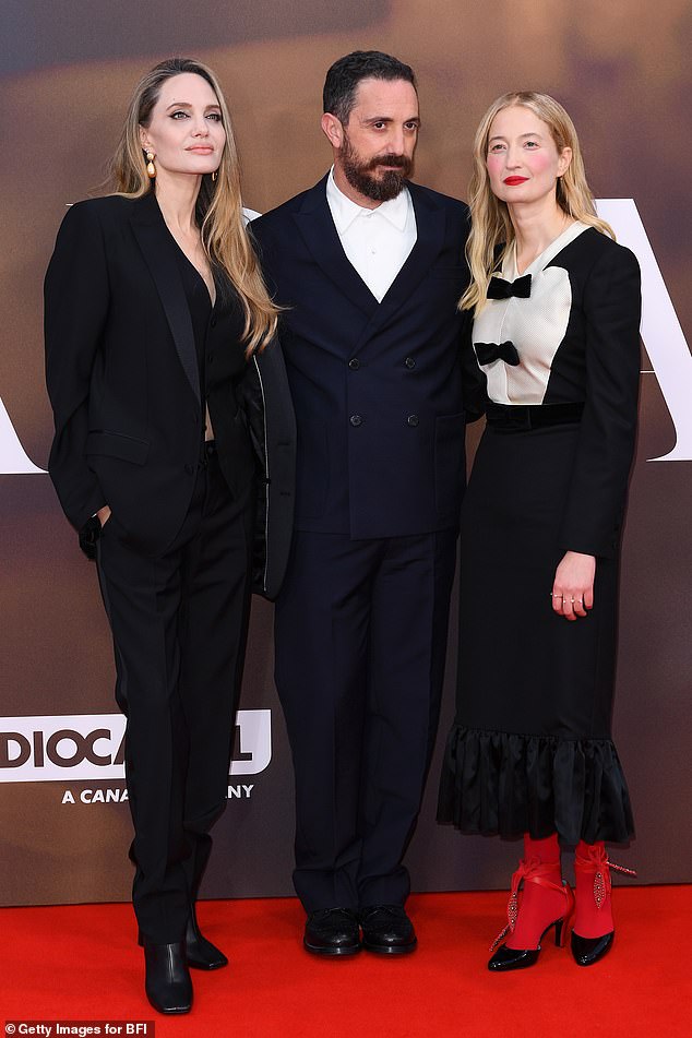 Angelina looked in good spirits as she posed on the red carpet alongside Maria director Pablo Larrain and her co-star Alba Rohrwacher