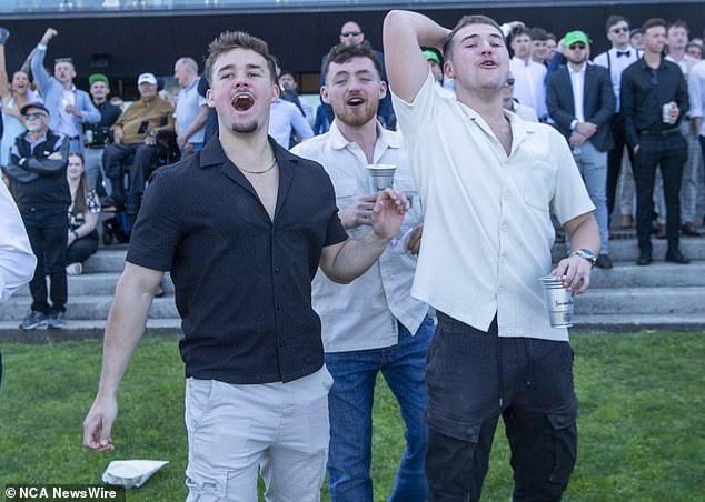 A day at Royal Randwick is guaranteed to offer plenty of color (photo, enthusiastic punters along the track)