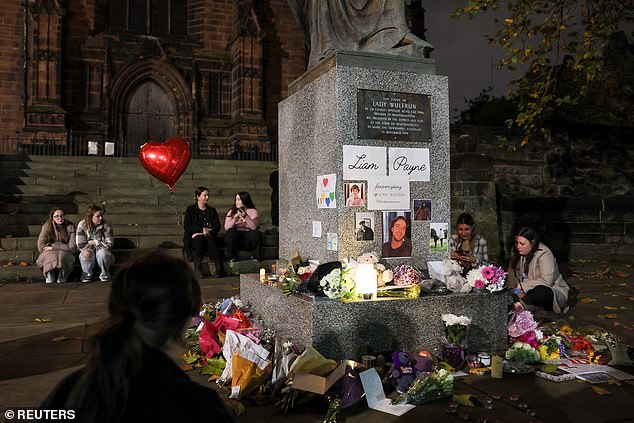 Tributes and flowers are placed outside St Peter's collegiate church in memory of former One Direction singer Liam Payne, in Wolverhampton