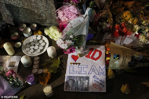 Grieving fans left heartfelt messages, flowers, candles and balloons for Liam Payne in his hometown