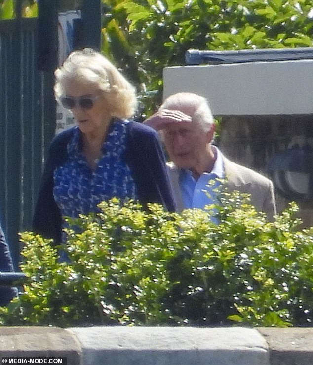 The Queen looked effortlessly chic as she admired the gardens behind sunglasses, while Charles squinted in the bright morning sunshine