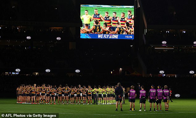 AFL players, coaches and referees observed a minute's silence in honor of victims of gender-based violence against women on August 30, 2024 (Photo: Round 08 match in Adelaide)