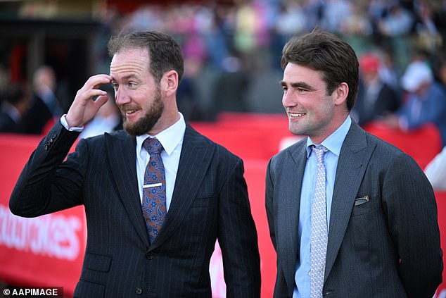 Trainers Ciaron Maher and David Eustace watch as jockey Craig Williams rides the mare to victory